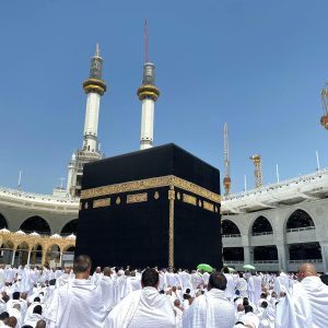 Crowd of worshippers in Mecca surrounding the Kaaba at the Grand Mosque during pilgrimage.