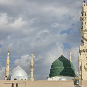Stunning view of Prophet's Mosque showcasing the iconic Green Dome against cloudy skies.