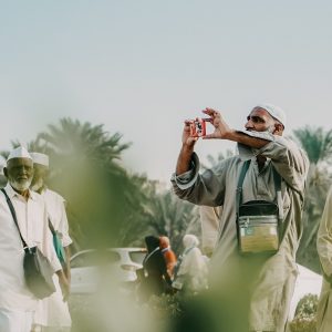 a man taking a picture of a group of people