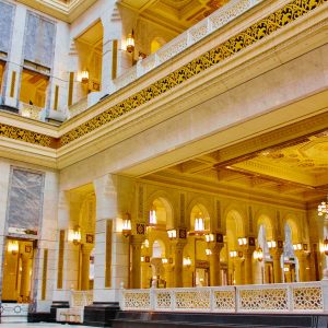 the inside of a large building with chandeliers