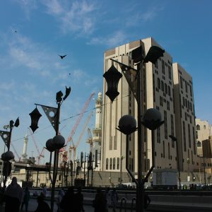 a large building with a tall clock tower in the background