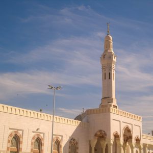 A large white building with a clock tower
